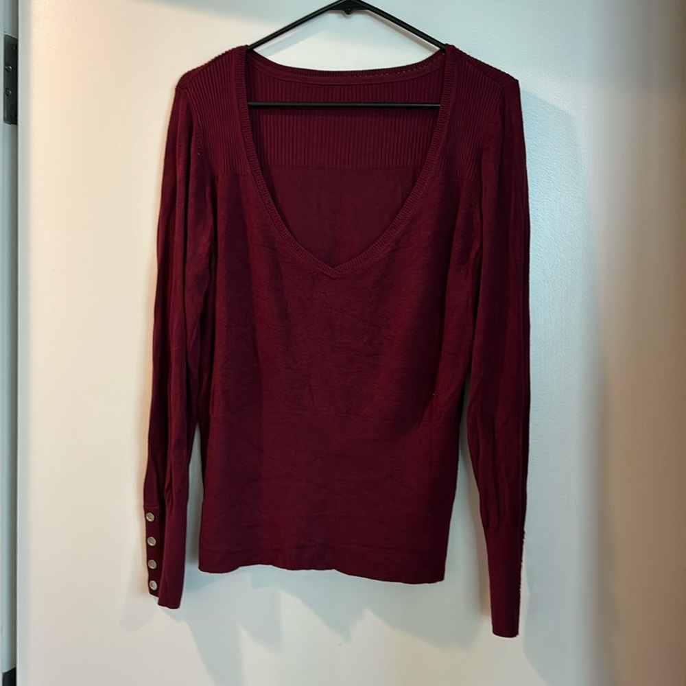 Light weight burgundy sweater with silver snap detail on sleeves